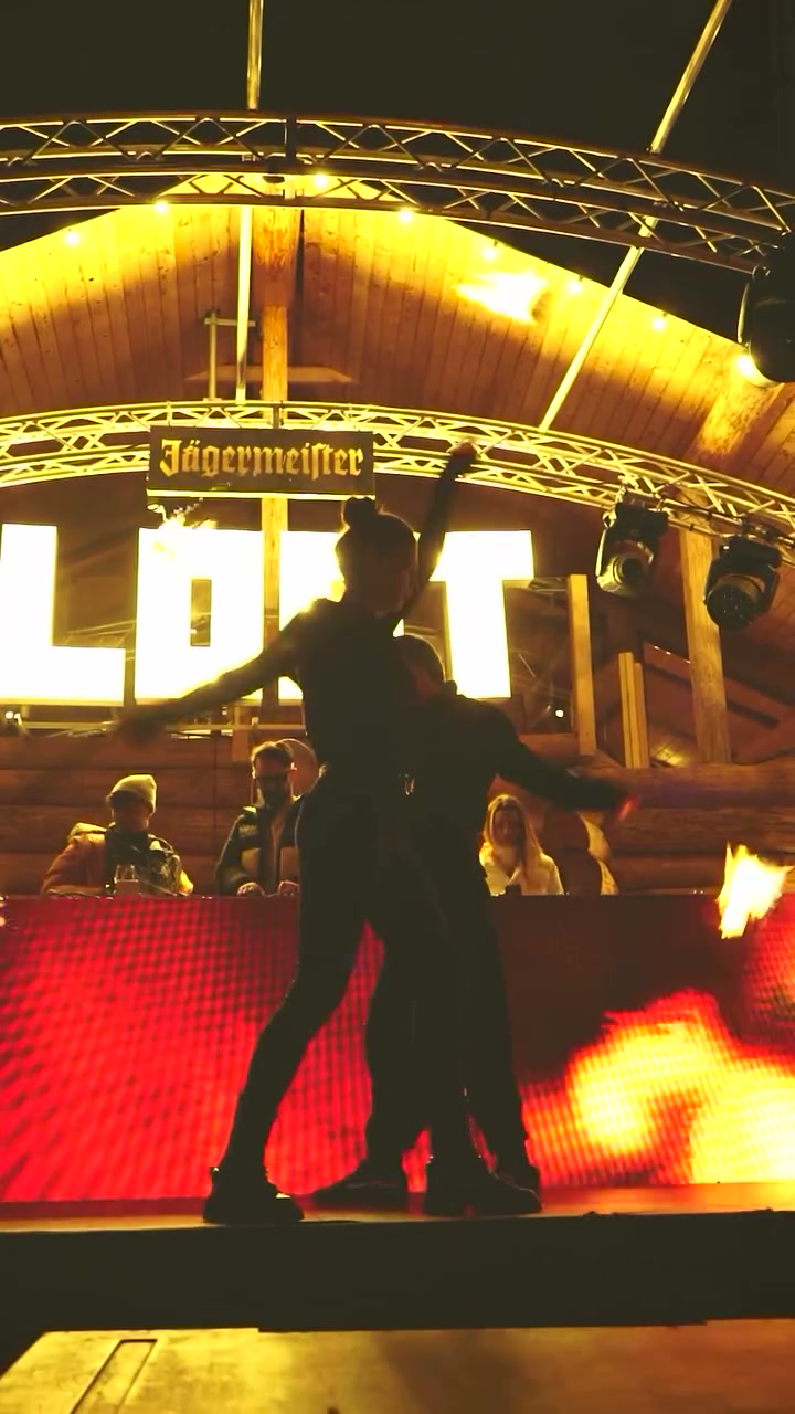 Two Royal Entertainment performers on stage during a fire show