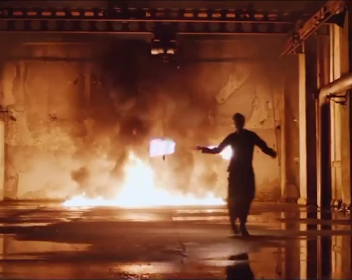 Column of ground flame with the performer in the foreground